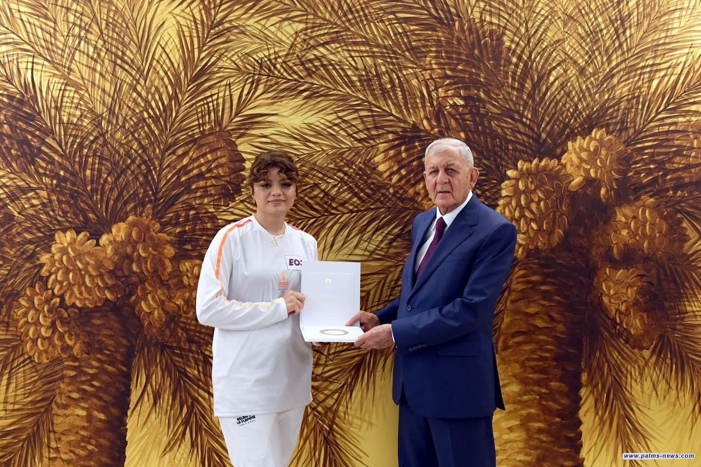 رشيد يستقبل شيلان أول عراقية تحملة شعلة الأولمبياد ويشيد بدورها